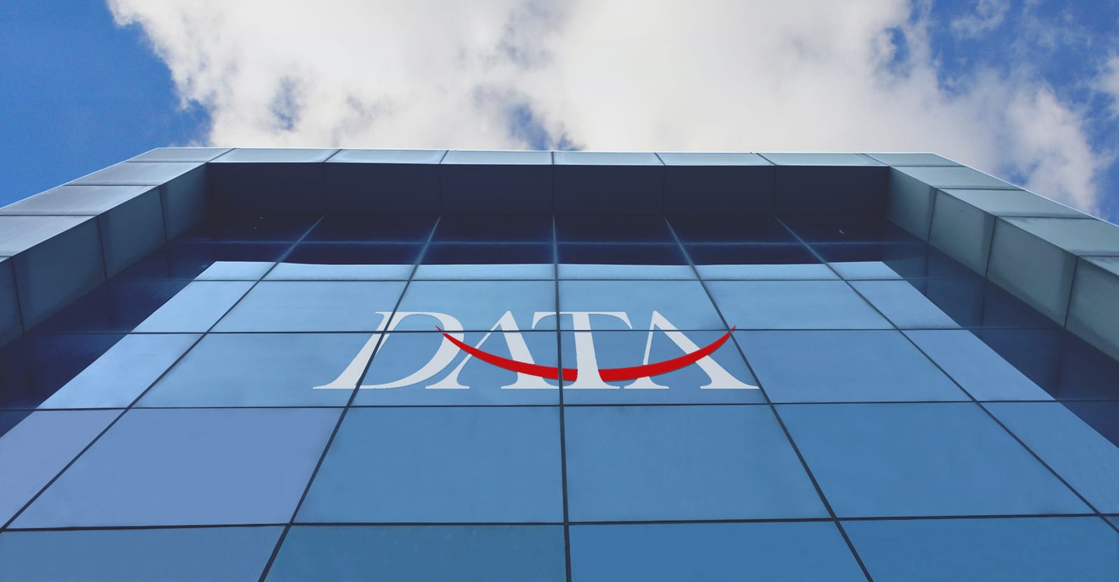 The Data Group building at Station Road, Durgapura, Jaipur, with the Data Group mark on its glass façade.